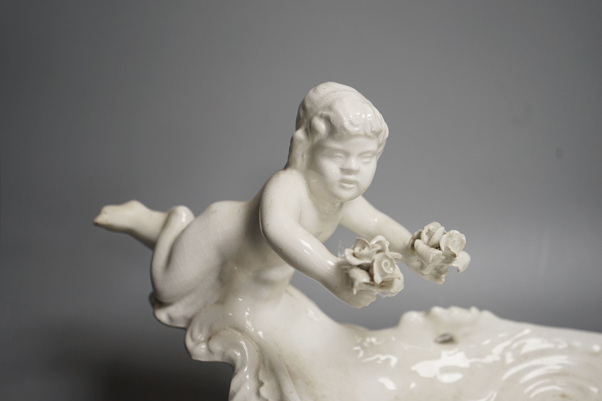 An Italian glazed pottery centrepiece, 63cm